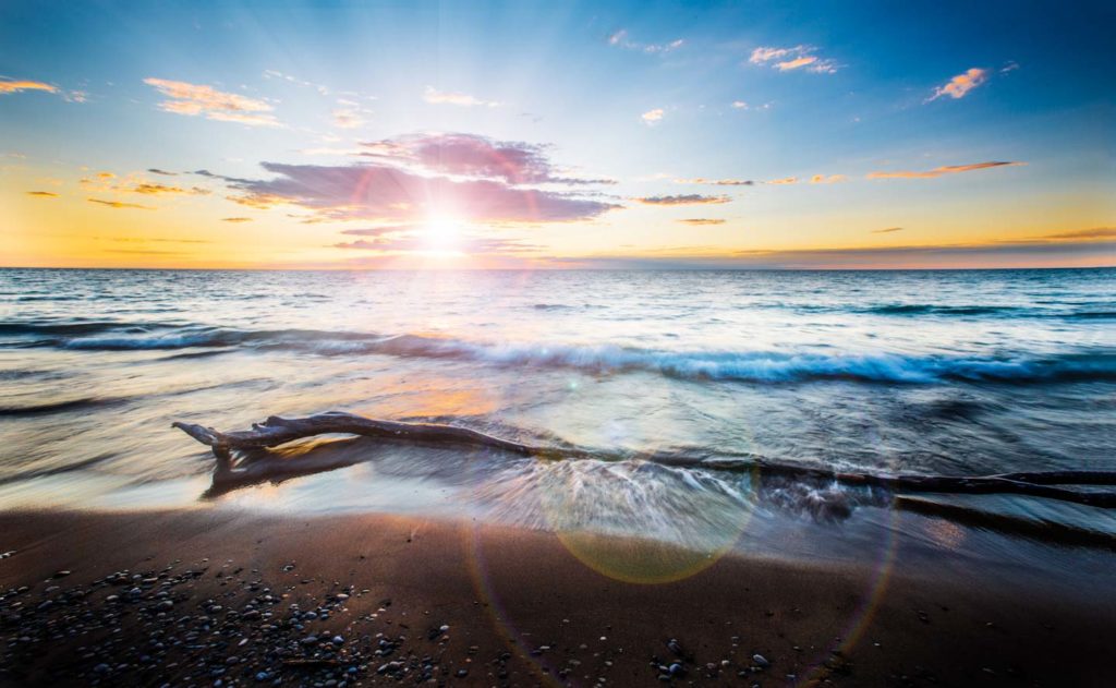 Image of beach at sunset using multiple blended images