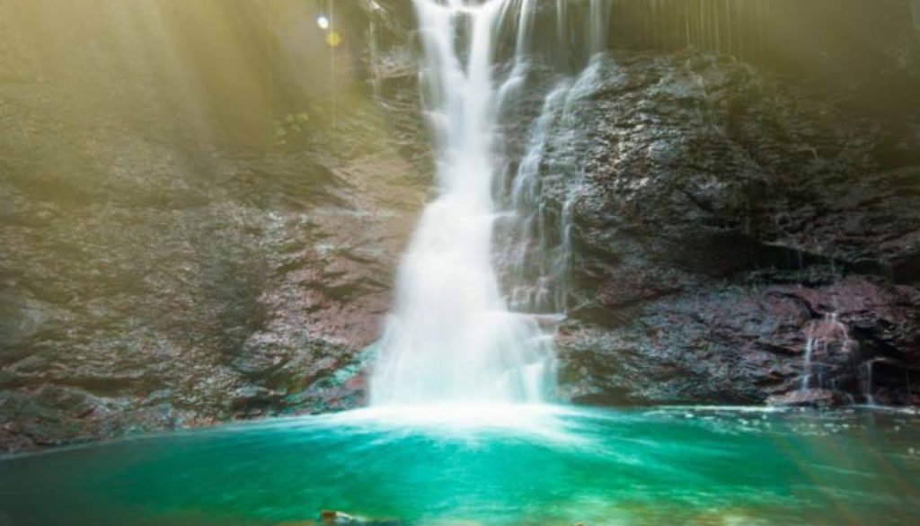 image of lower chedoke falls in hamilton ontario with sunbeams coming through